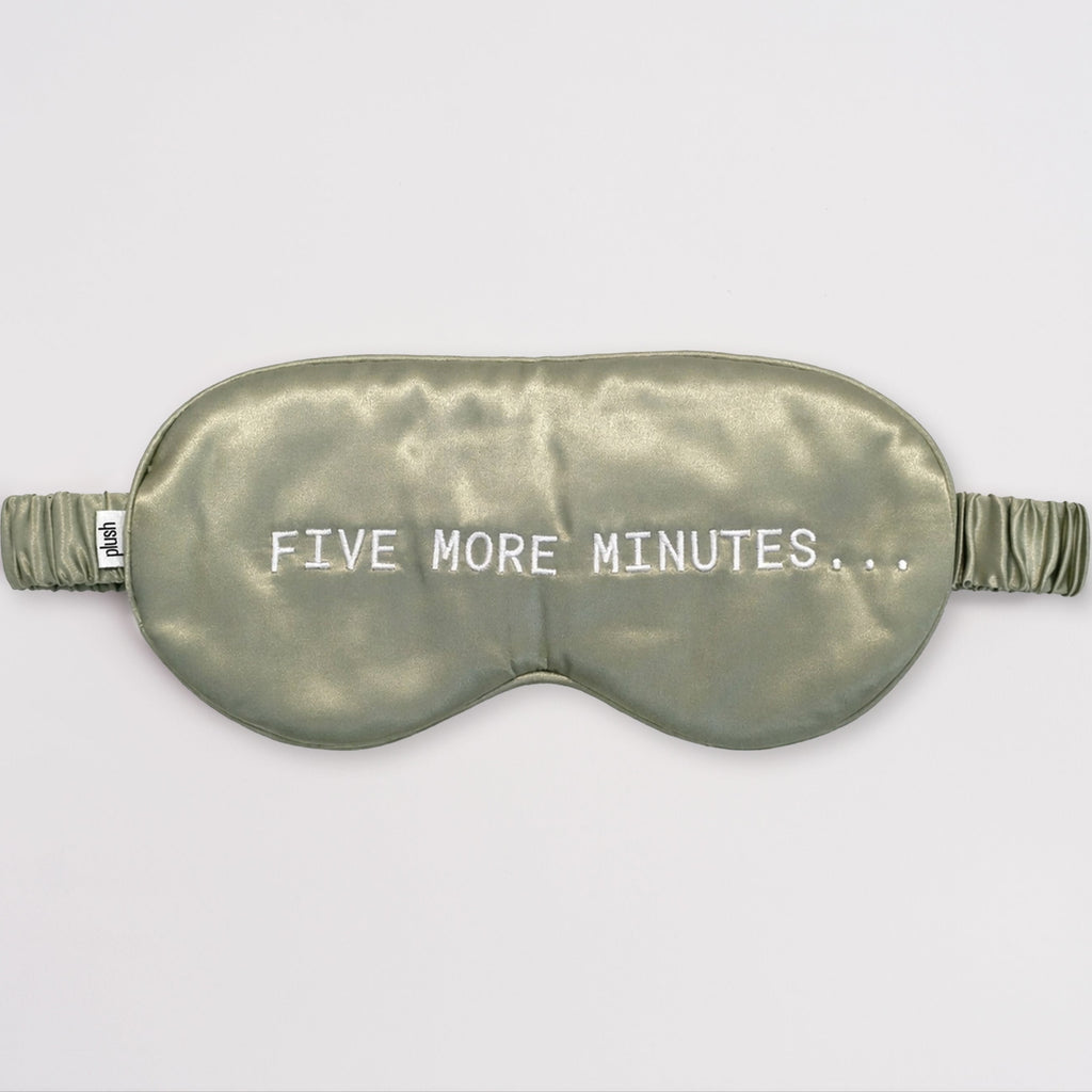 Olive green silk sleep mask with "FIVE MORE MINUTES" embroidery