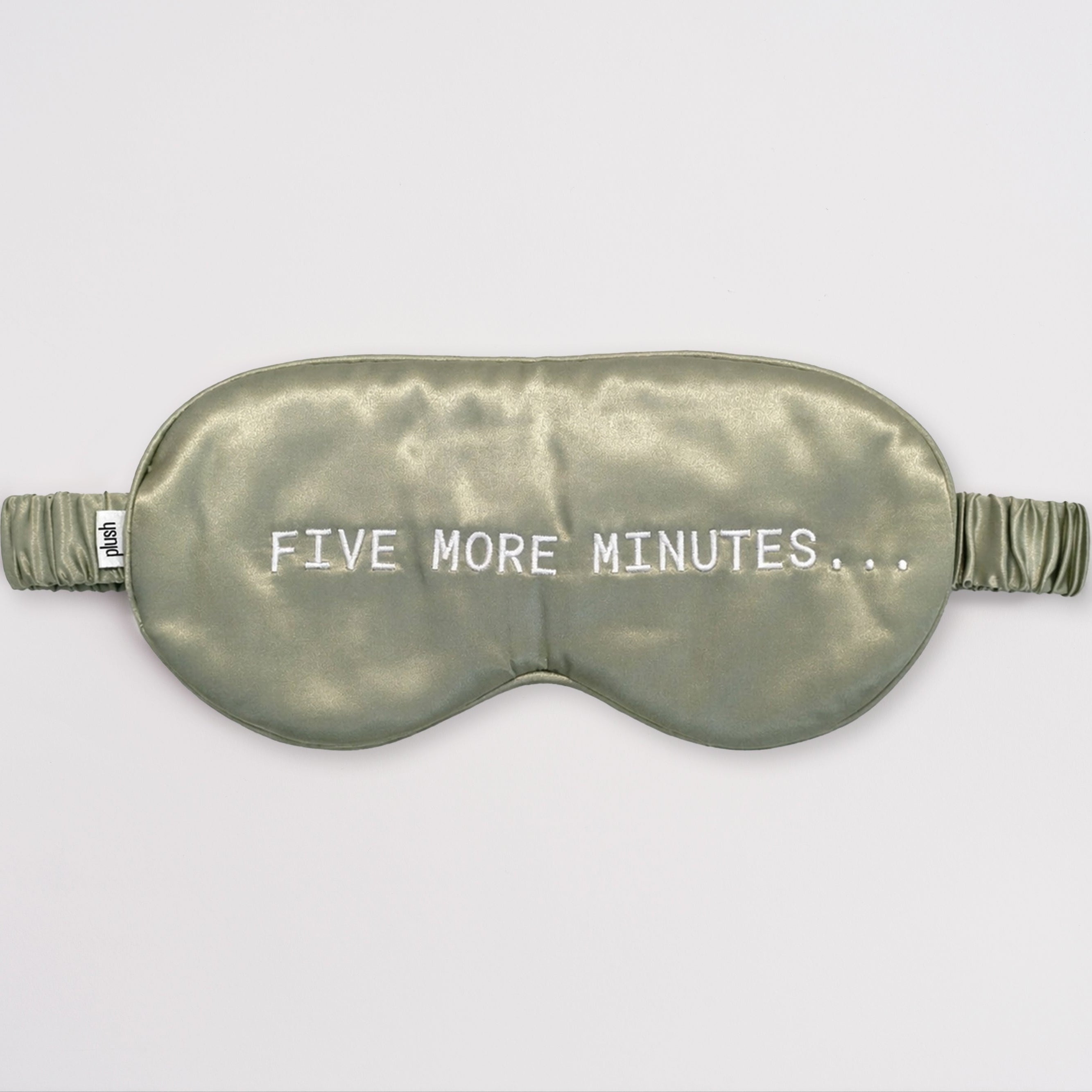 Olive green silk sleep mask with "FIVE MORE MINUTES" embroidery