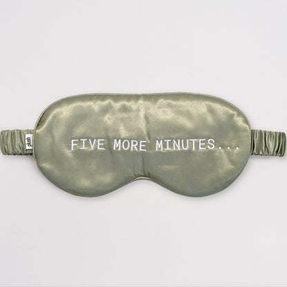 Olive green silk sleep mask with "FIVE MORE MINUTES" embroidery